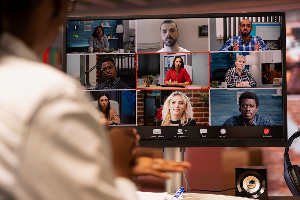 Laptop showing a person on PC